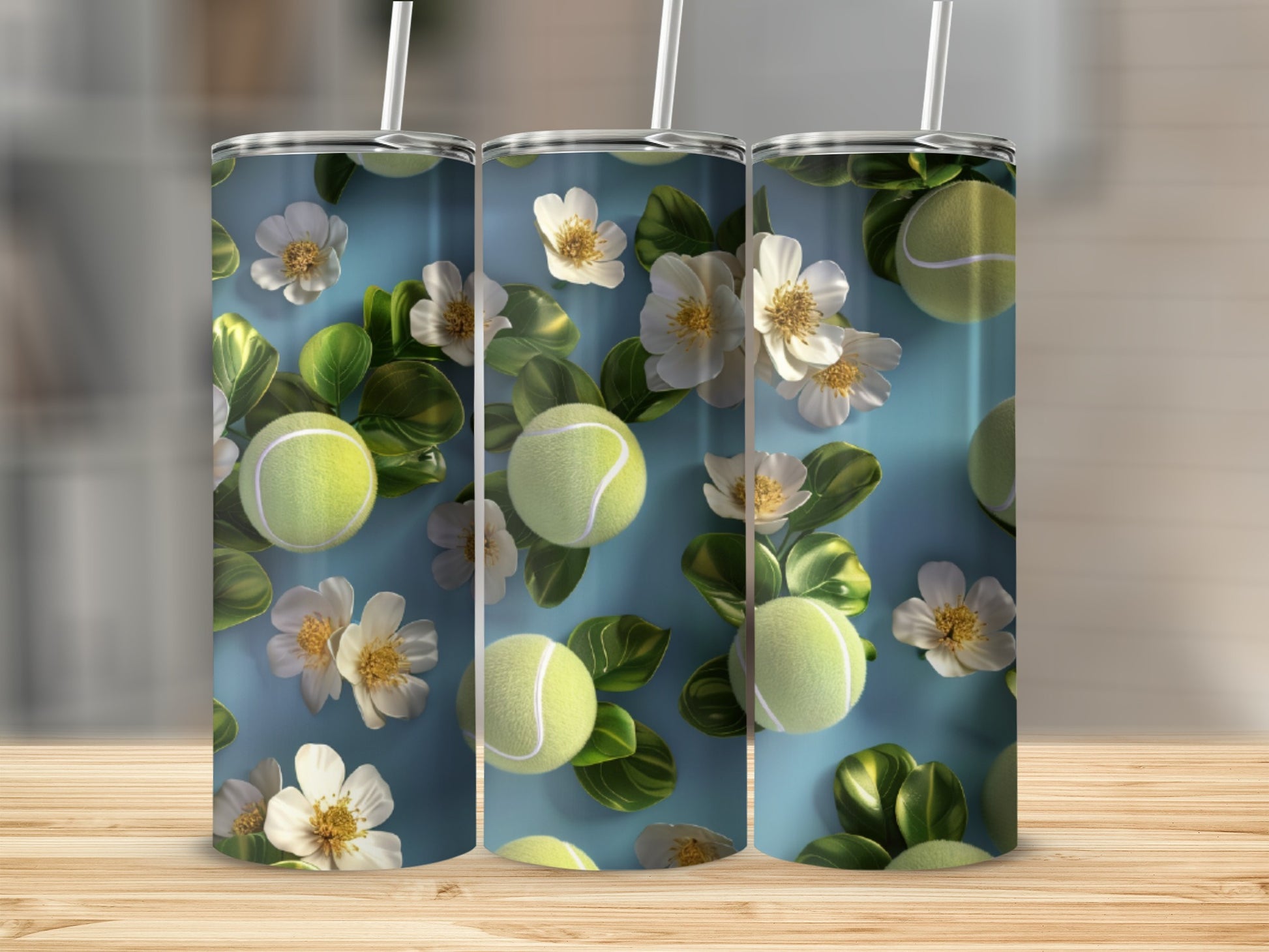 Triptych of tumblers featuring tennis balls and white flowers on blue background.