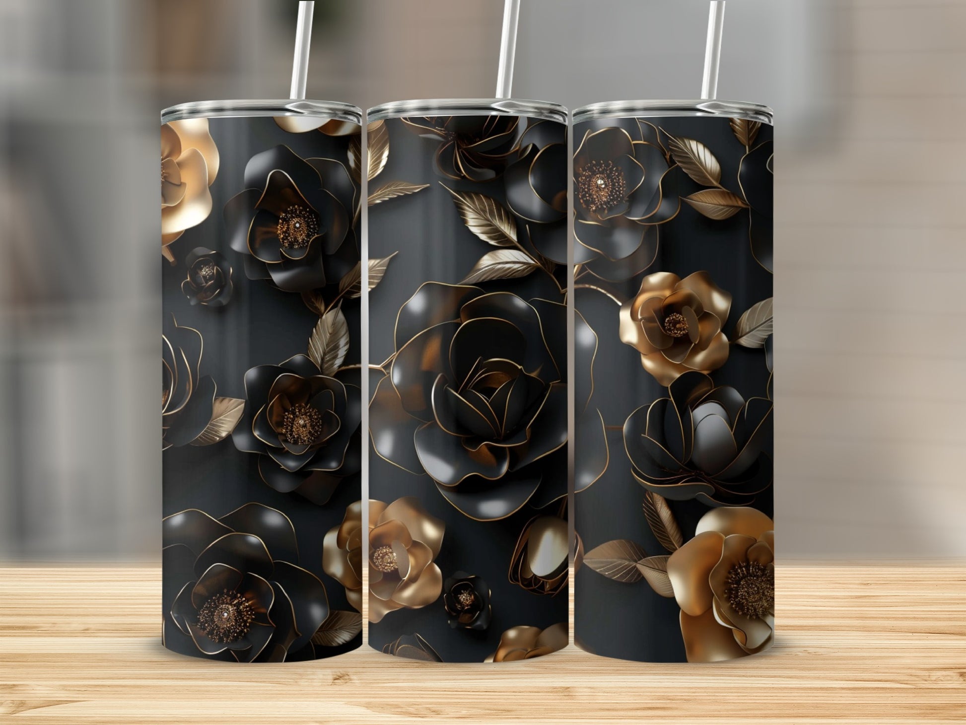 Three tumblers with a black and gold floral design.