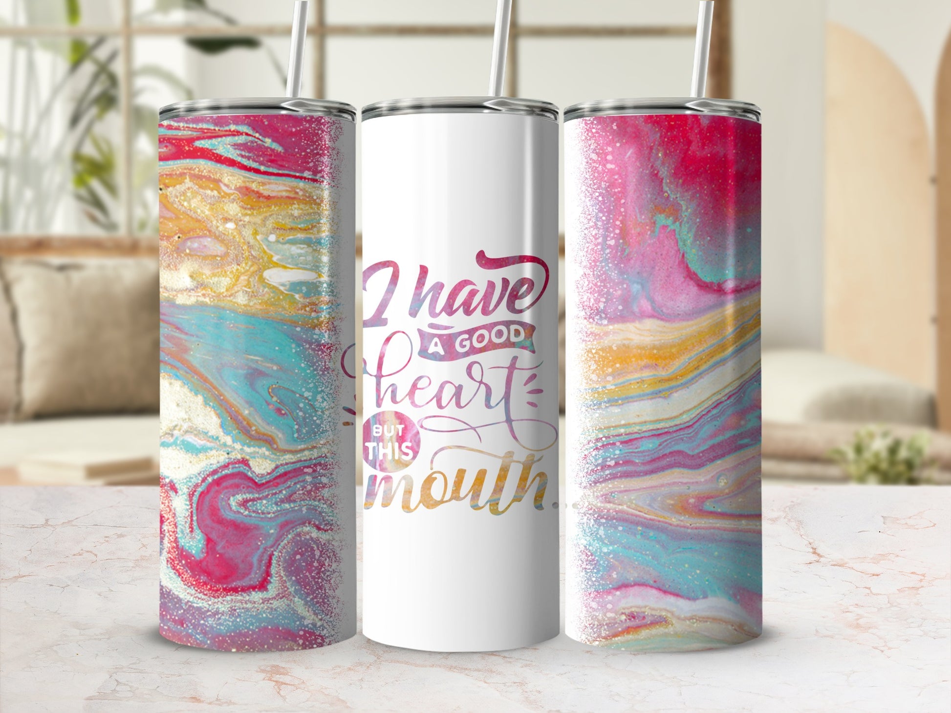 White tumbler with "I have a good heart but this mouth" in colorful script.