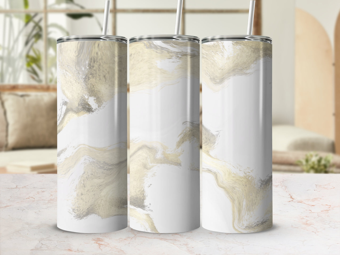 Three tall tumblers with a white and gold marble design.