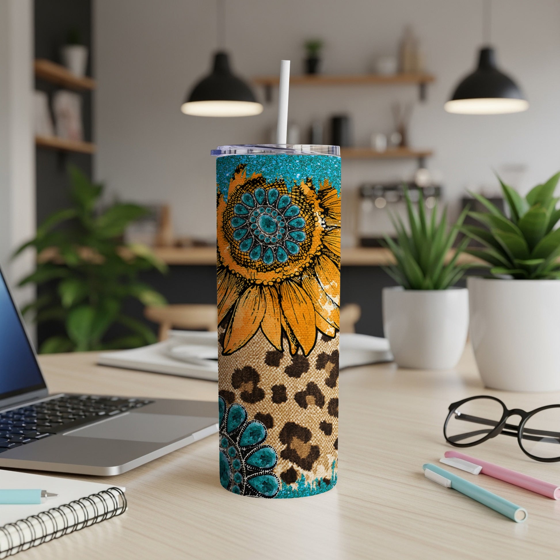 Sunflower and leopard print skinny tumbler with turquoise accents.