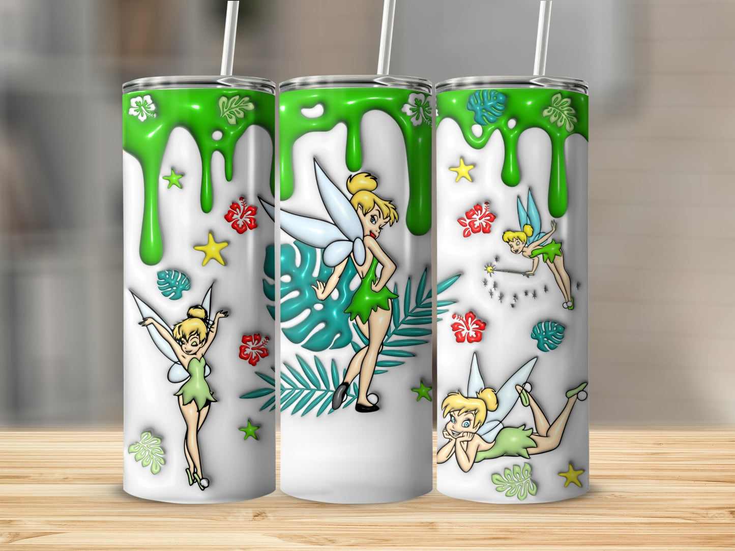 Three tumblers with Tinkerbell designs, dripping green slime, and floral accents.