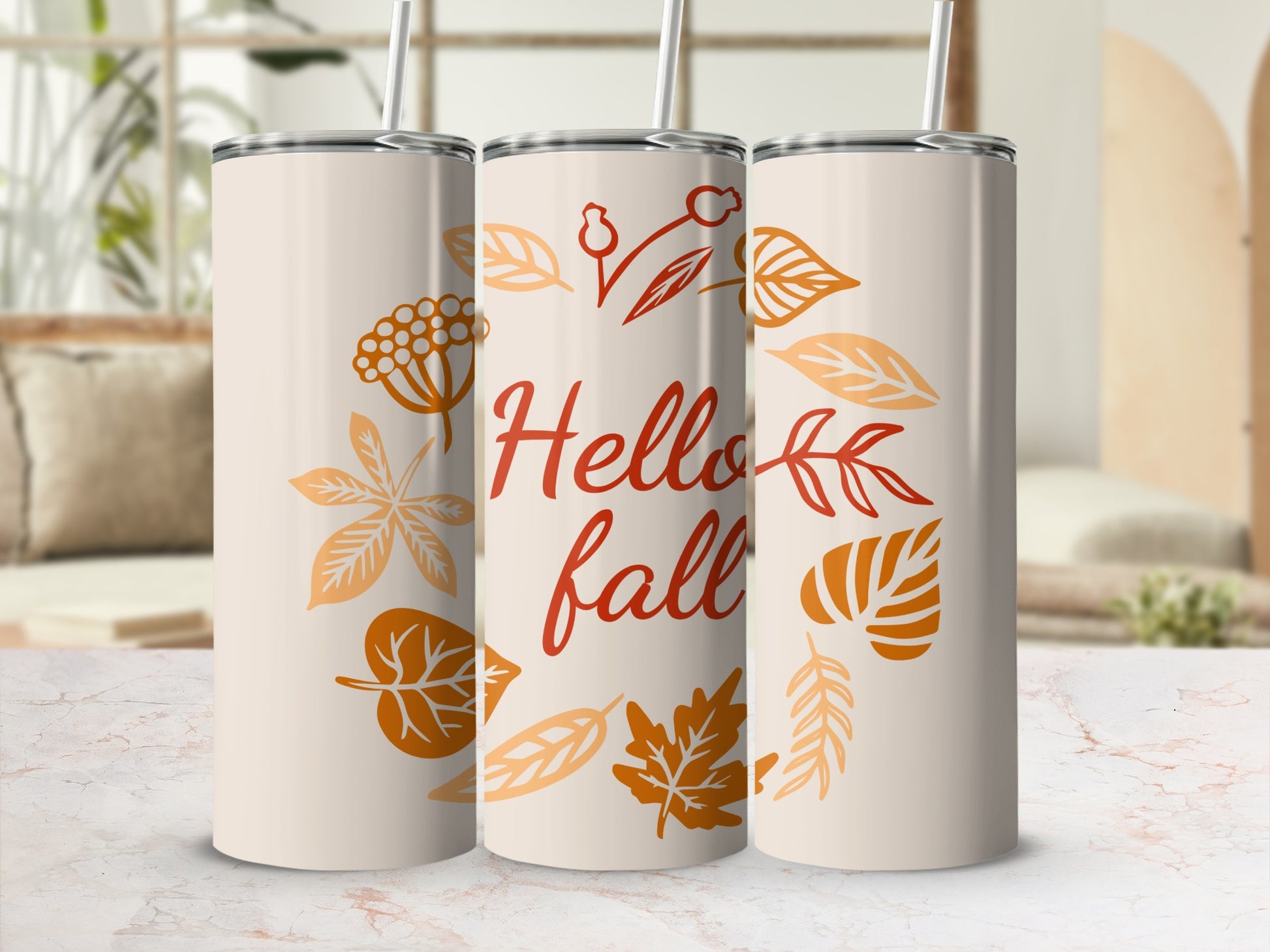 Three cream tumblers with "Hello Fall" and autumn leaf designs.