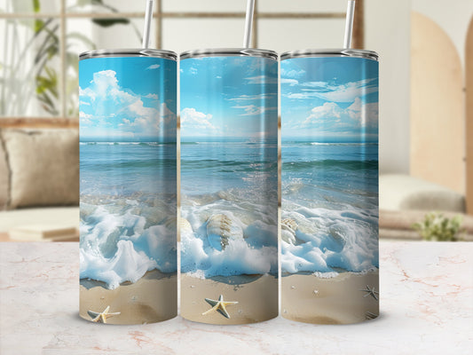 Three tumblers featuring a beach scene with waves, sand, and starfish.