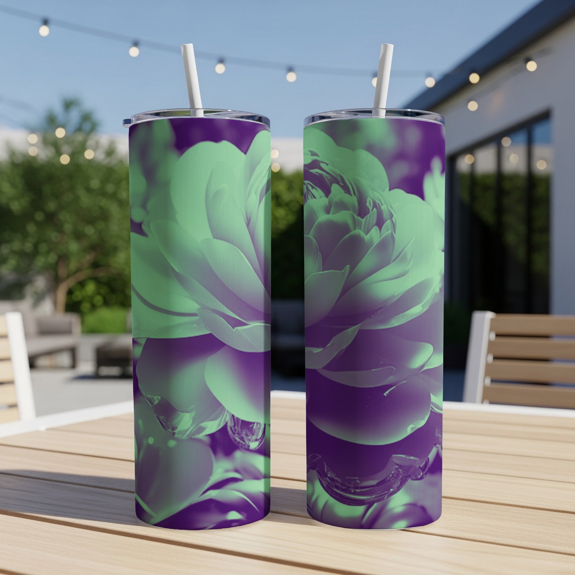 Two tumblers with a close-up floral design in green and purple.