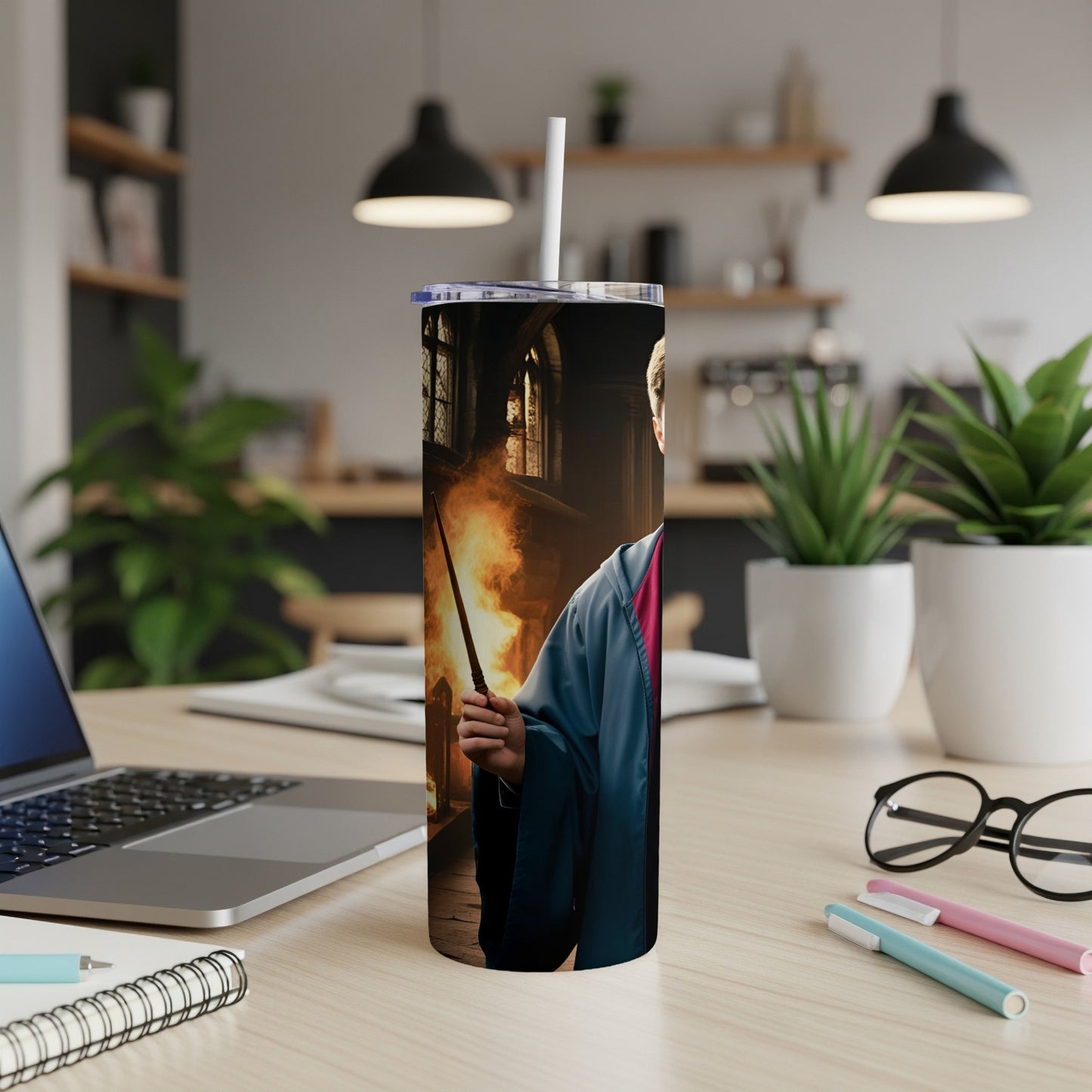 Harry Potter holding a wand, a tall stainless steel tumbler.