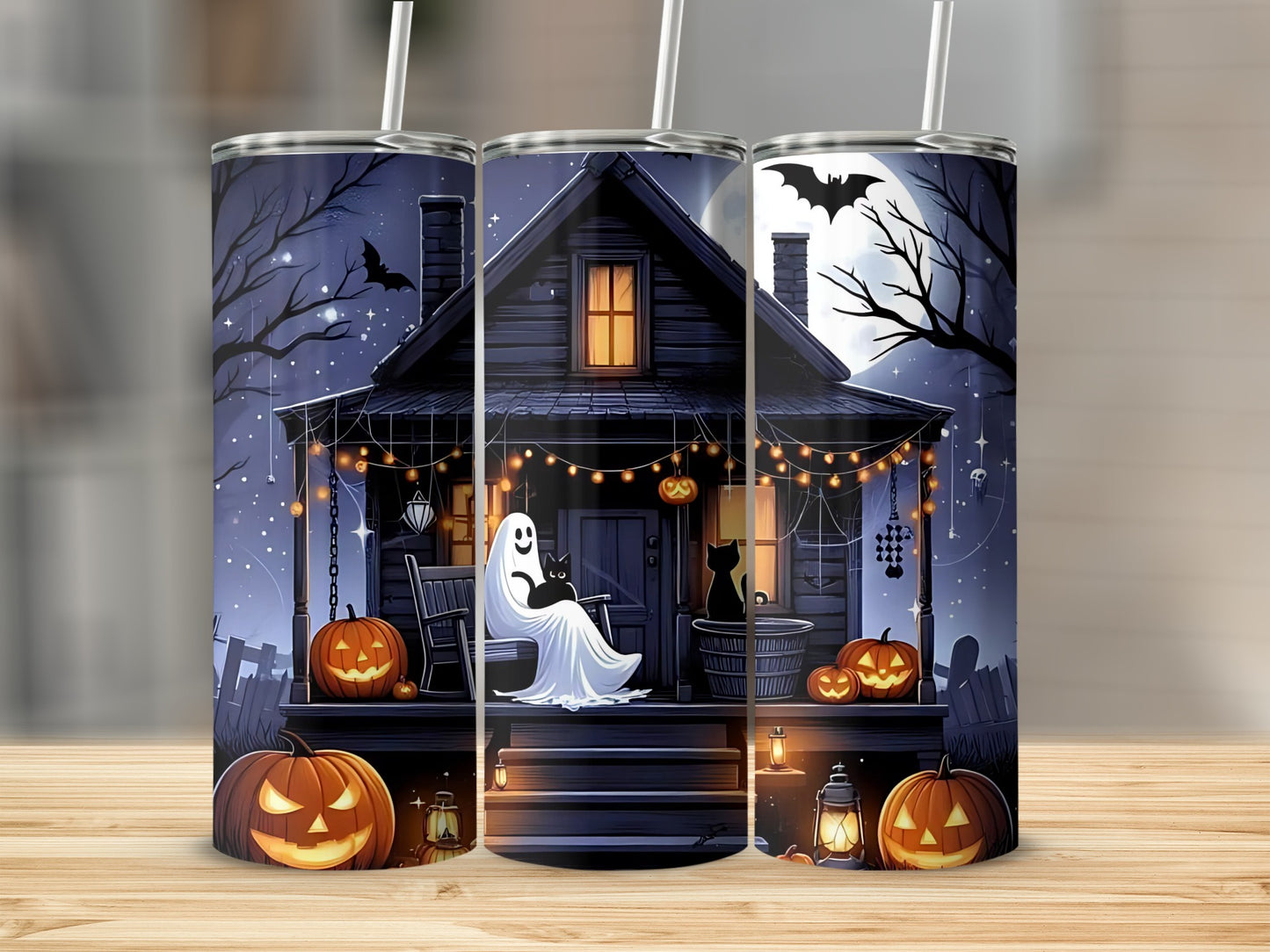 Halloween tumbler with haunted house, ghost, cats, pumpkins, and bats under the moon.