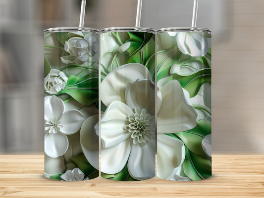 Three tumblers with embossed white magnolia blossoms and green leaves.