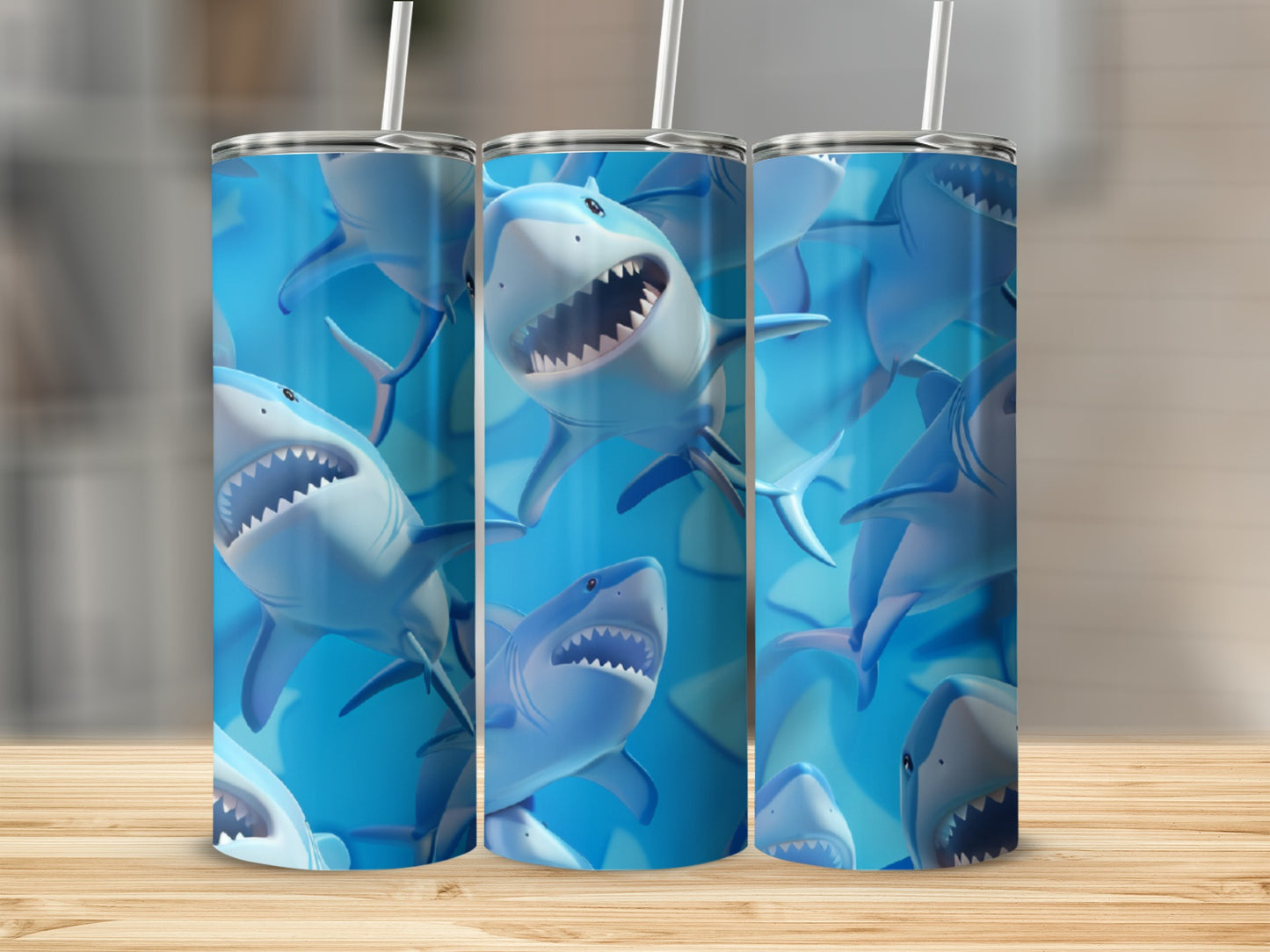 Three tall tumblers with cartoon sharks and blue water backgrounds.