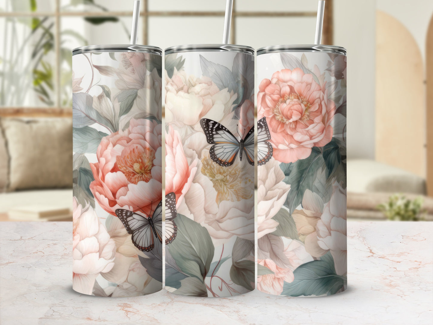 Three tumblers with a floral and butterfly pattern.
