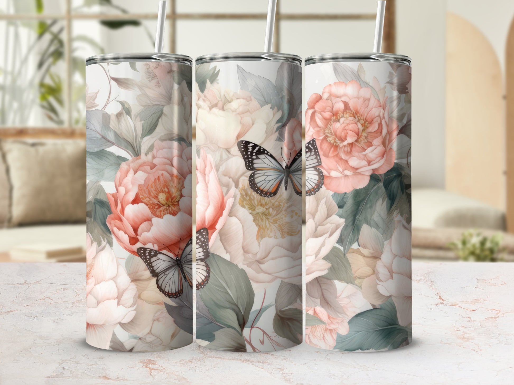 Three tumblers with a floral and butterfly pattern.