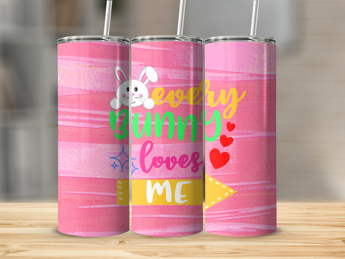 Pink tumbler with "every bunny loves me" text and bunny graphic.