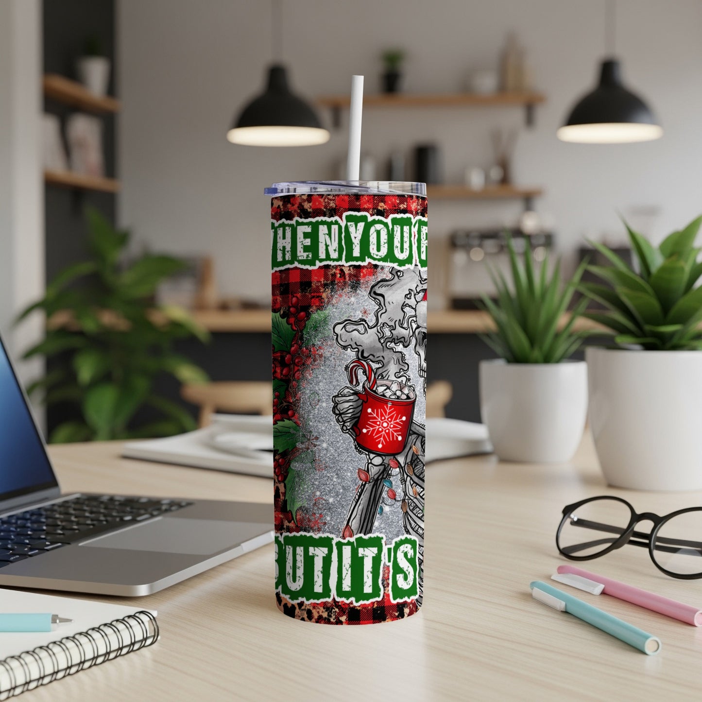 Tumbler with "When you're hot and it's cold" text and festive design.