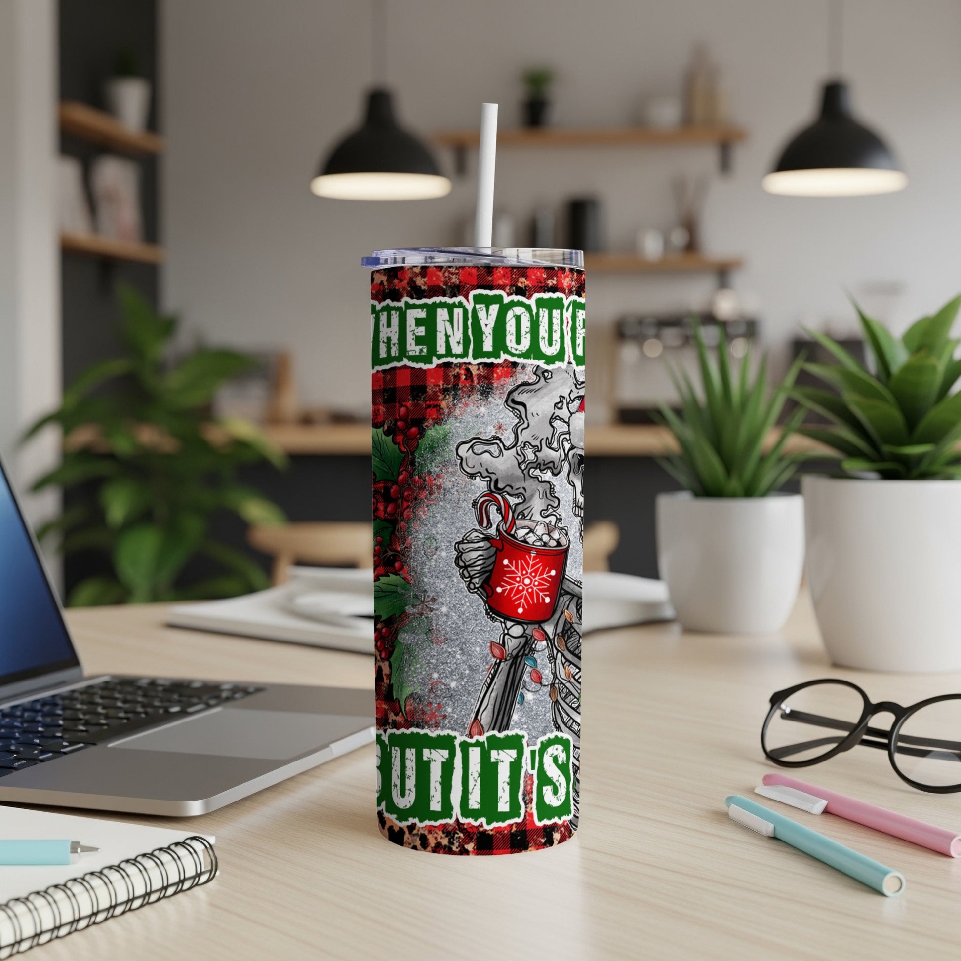 Tumbler with "When you're hot and it's cold" text and festive design.