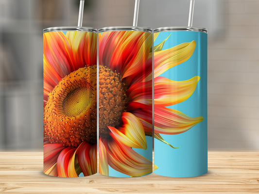 Three tumblers featuring a close-up, vibrant sunflower design on a light blue background.