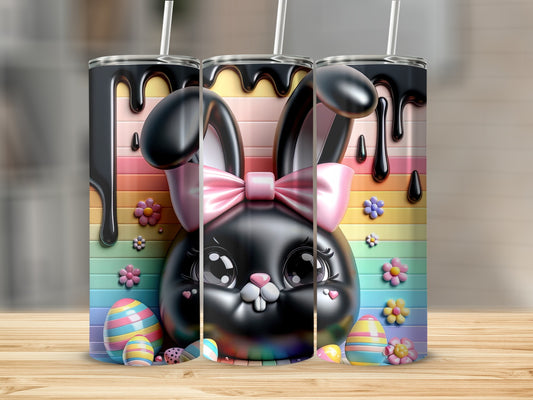 Black Easter bunny tumbler with pastel rainbow background and colorful eggs.
