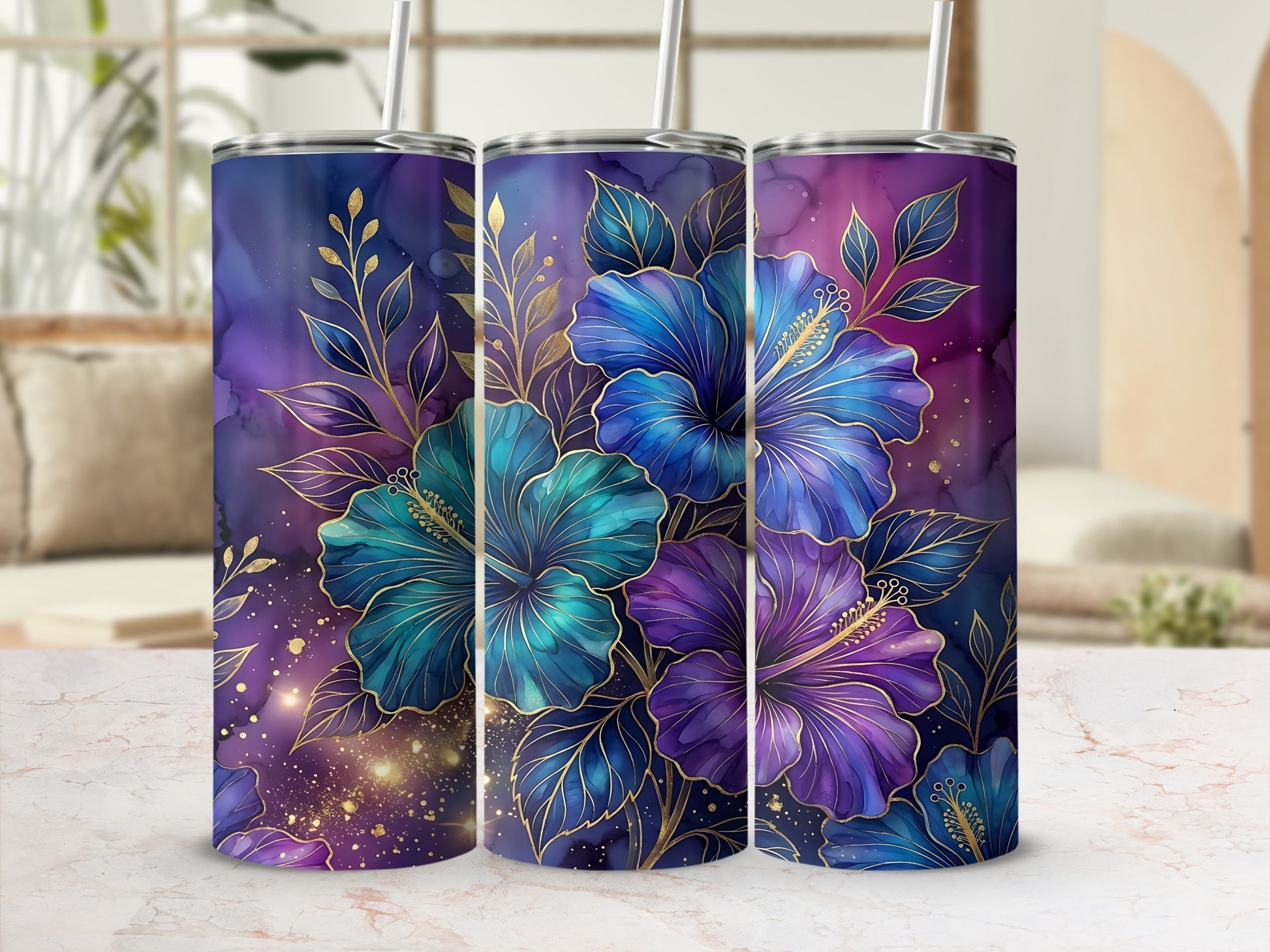 Three tumblers with purple and blue hibiscus flowers and gold accents.