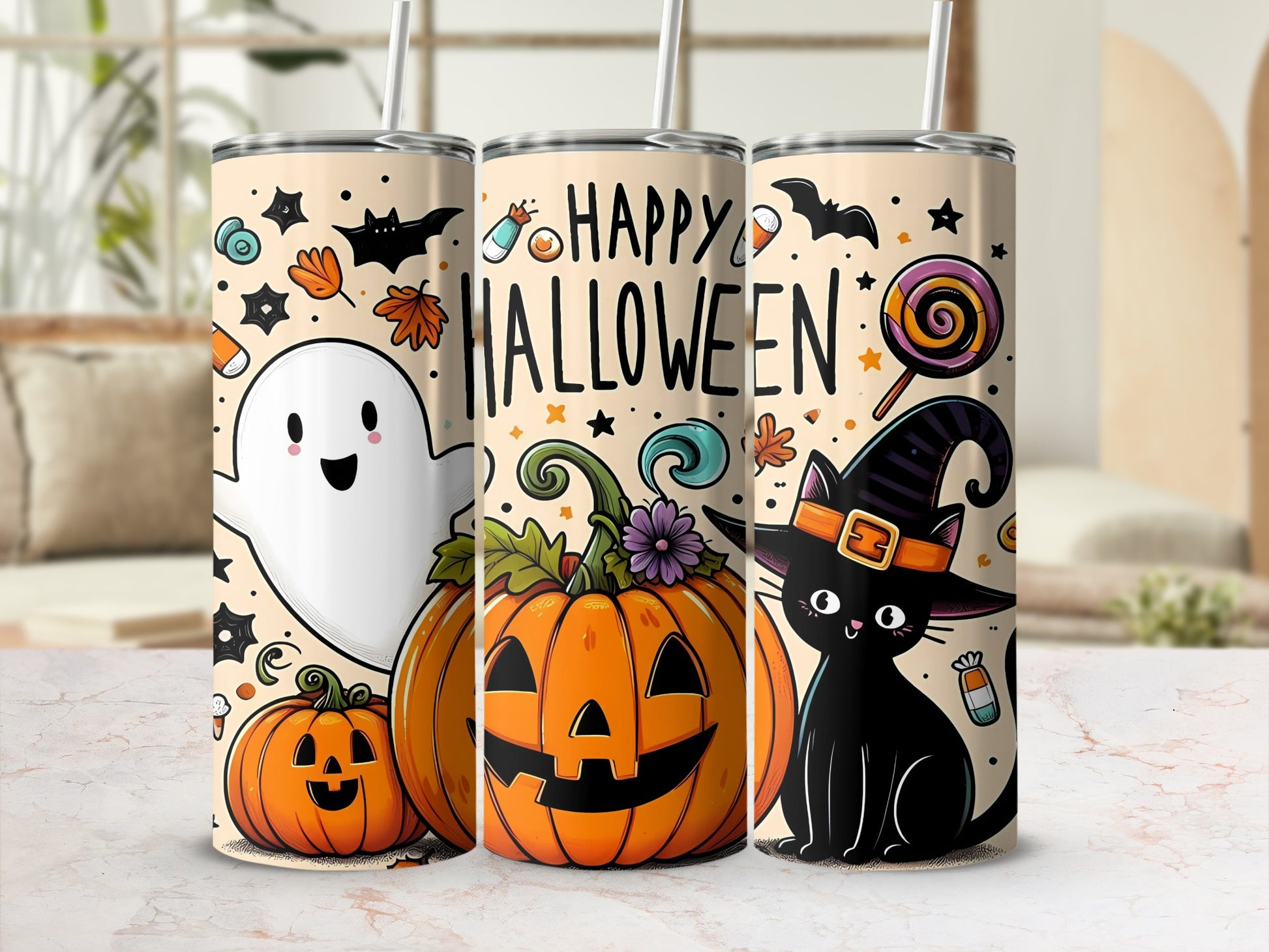 Three Halloween-themed tumblers with ghosts, pumpkins, bats, and a black cat.