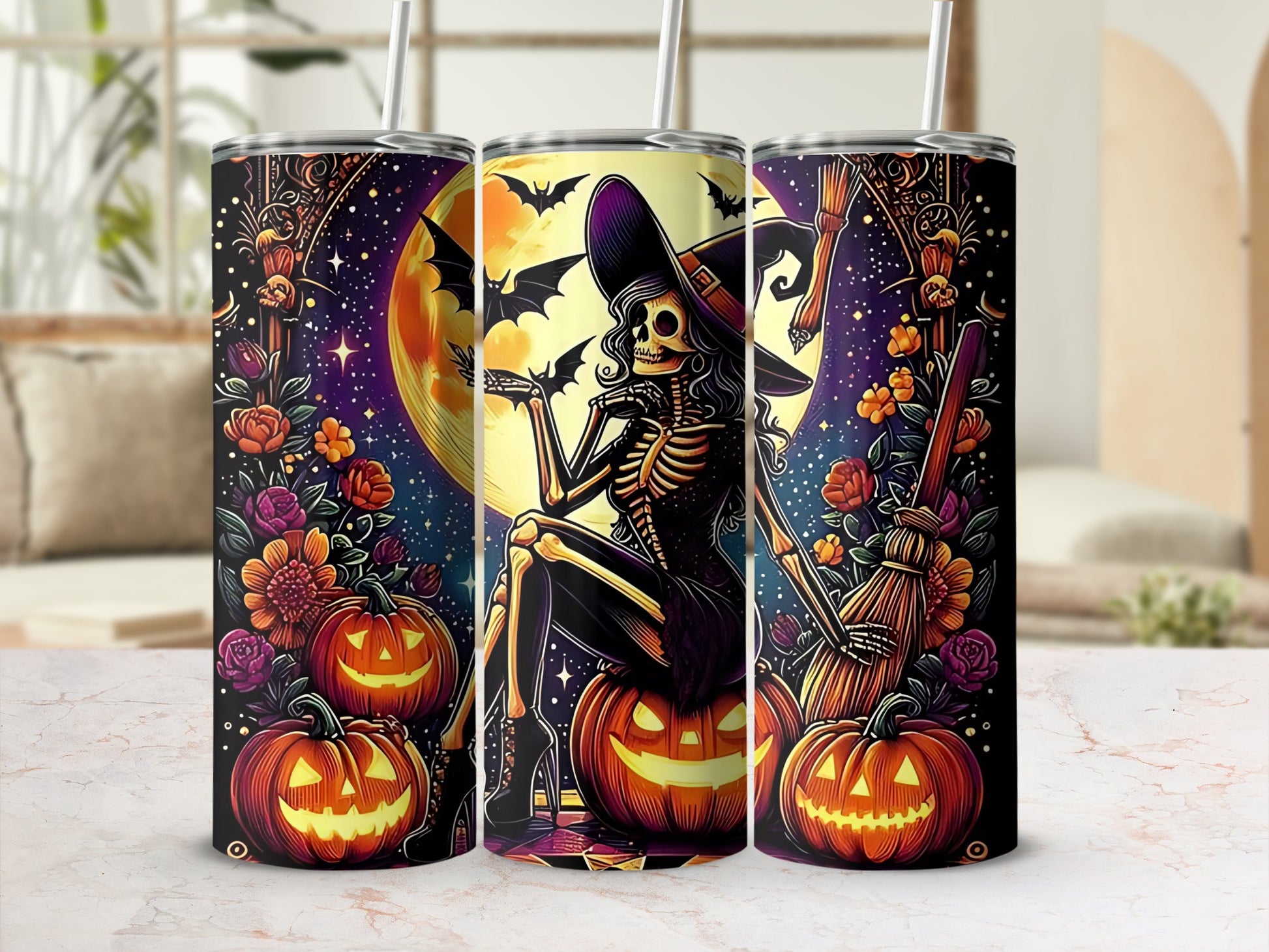 Three tumblers with Halloween skeleton witch, pumpkins, flowers, moon, and bats design.
