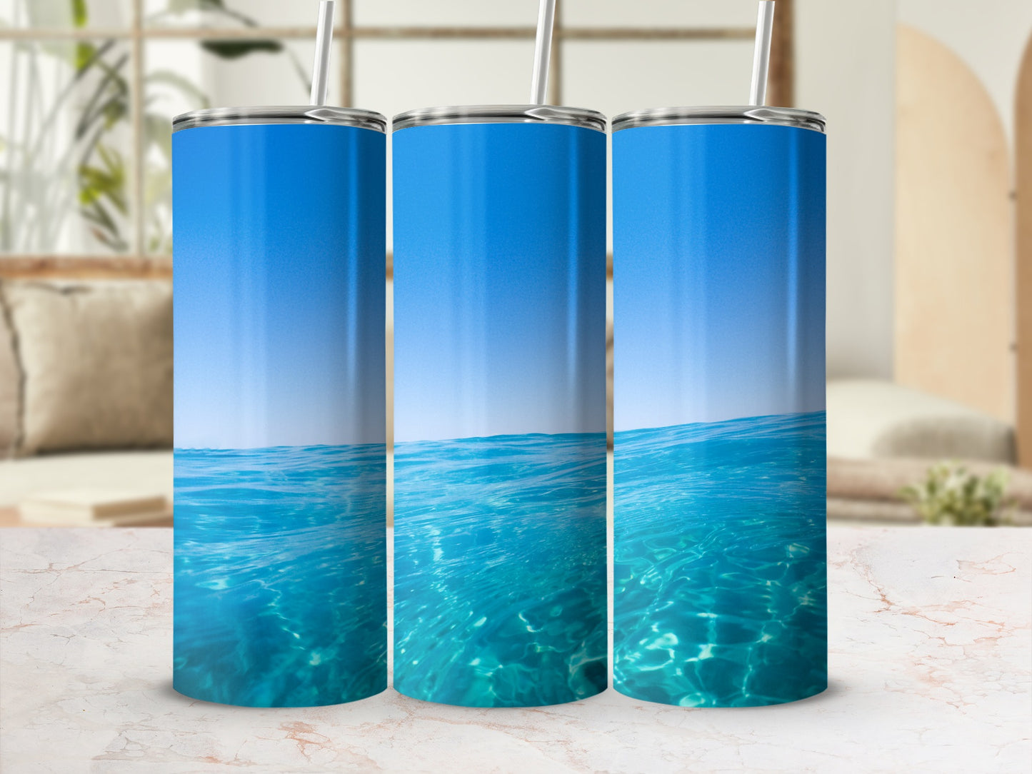Three tumblers with underwater ocean view and sky design.