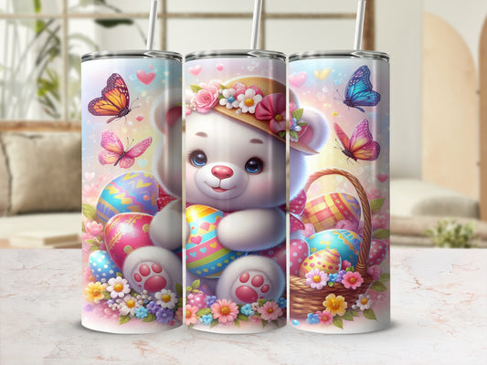 Cute teddy bear in Easter basket with painted eggs and butterflies.