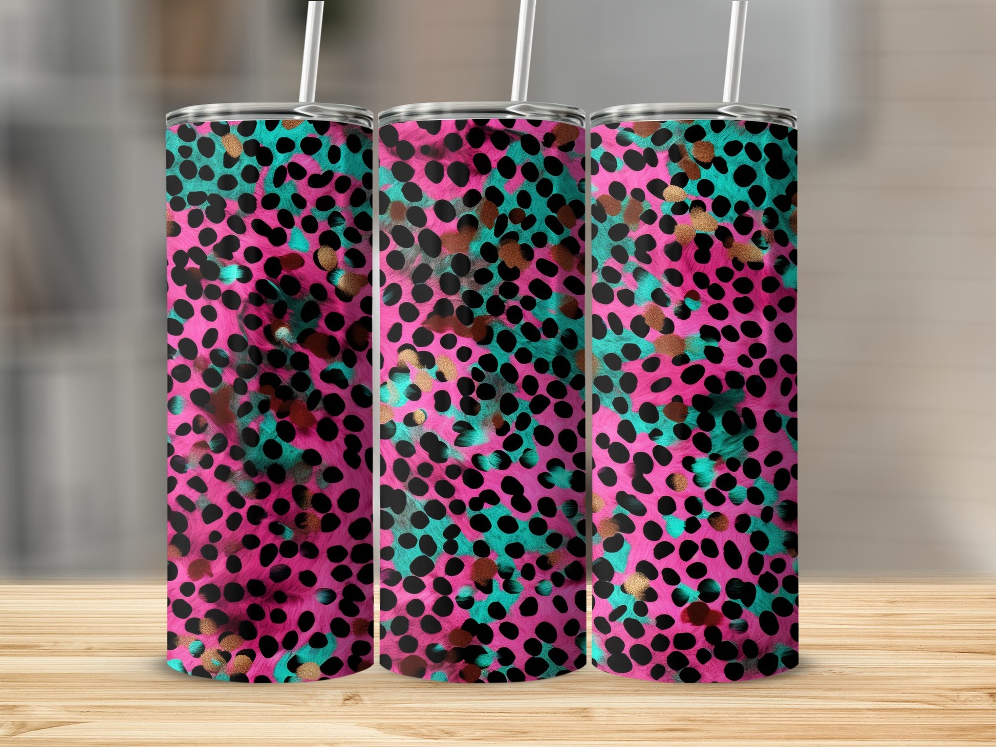 Pink, teal, and gold leopard print tumbler with straw.