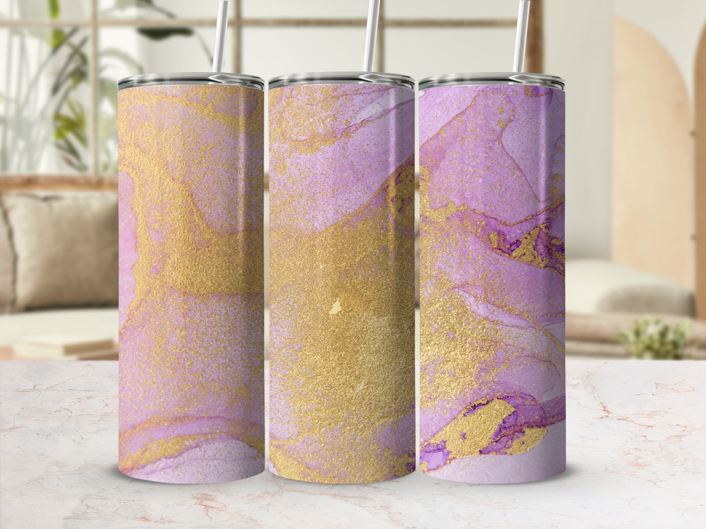 Three tumblers with purple and gold abstract marbled design and straws.