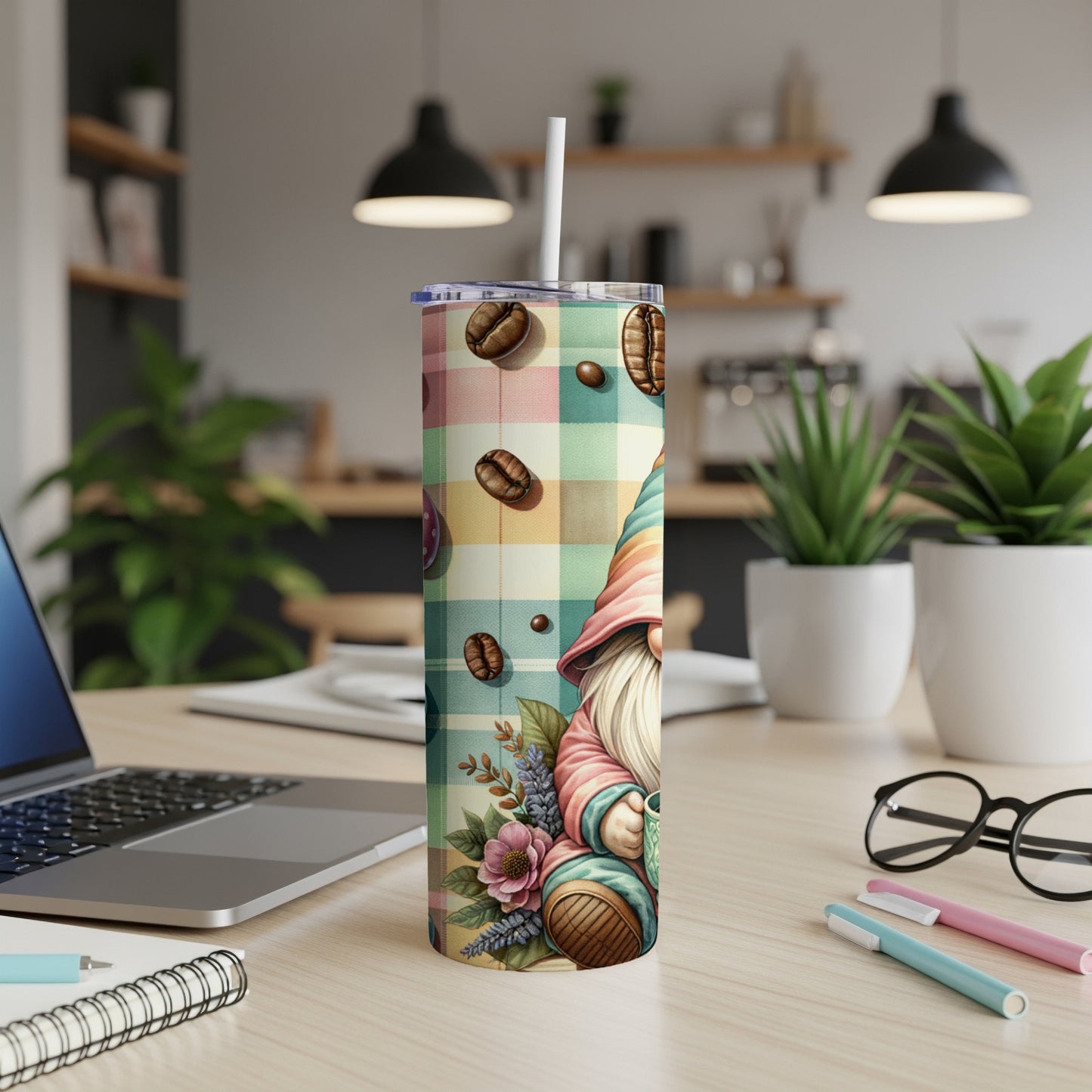 Gnome with coffee beans and flowers on a plaid tumbler.