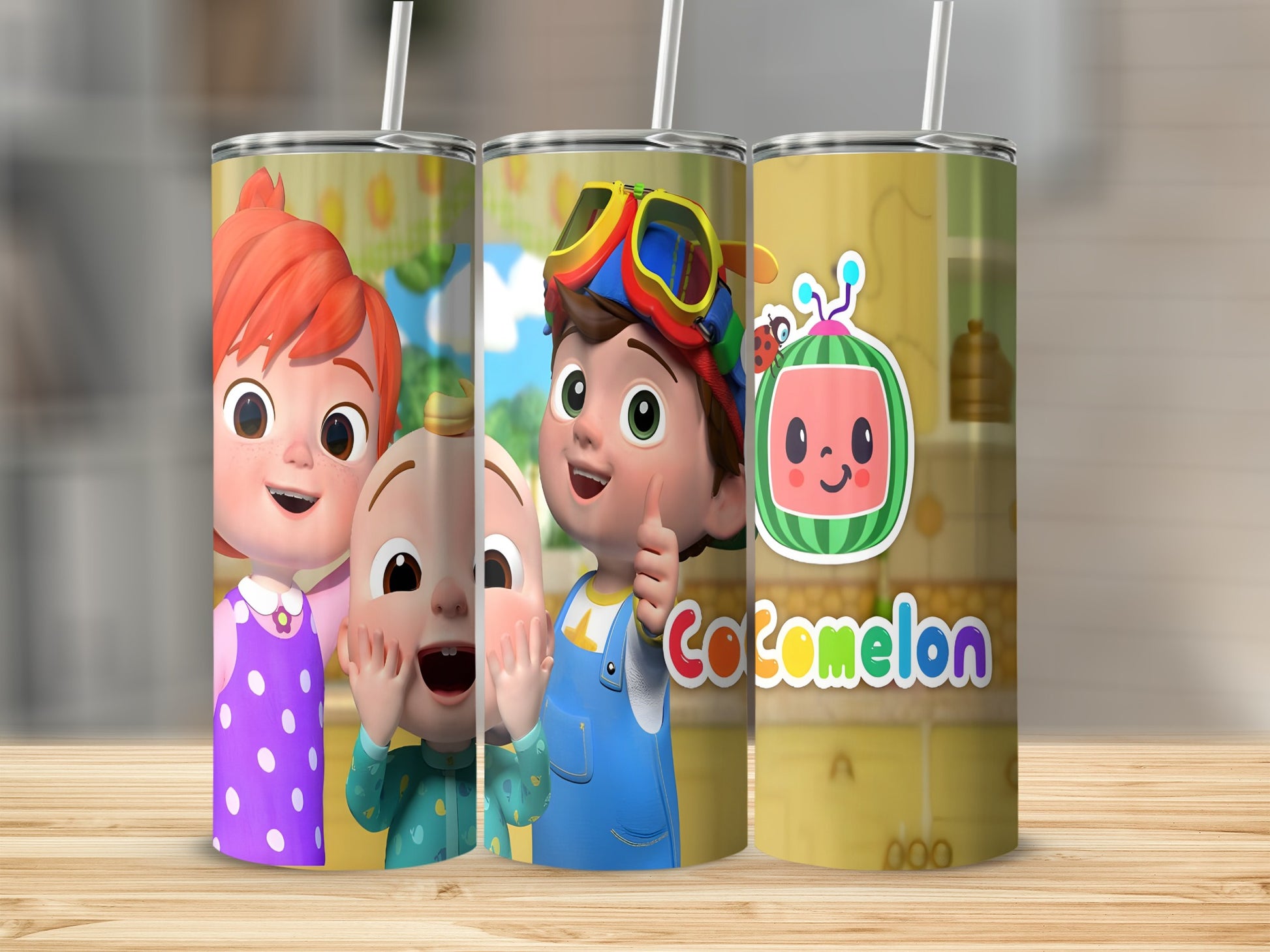 Three Cocomelon-themed tumblers with characters and logo.