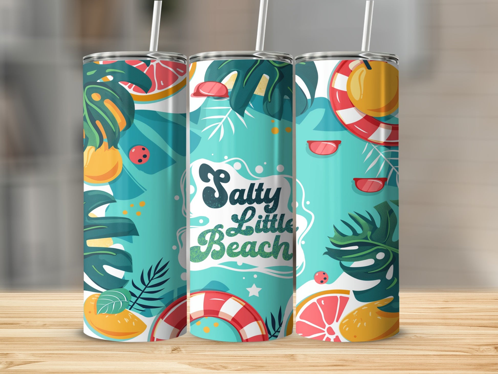 Tumbler with "Salty little Beach" text and tropical beach motifs.