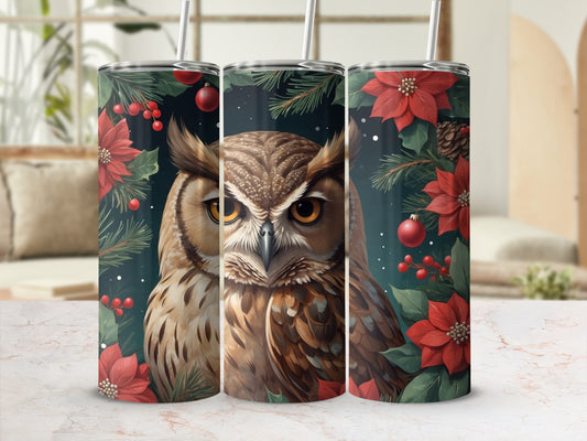 Close-up of an owl's face on a festive tumbler with poinsettias.