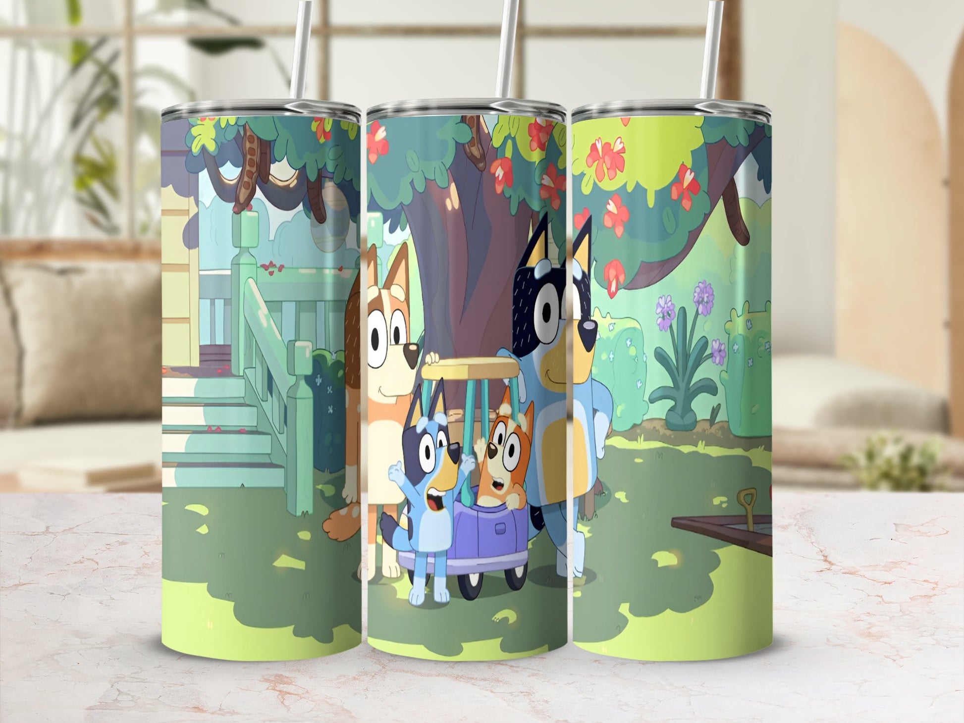 Bluey and Bingo characters on a cartoon tumbler with a straw.