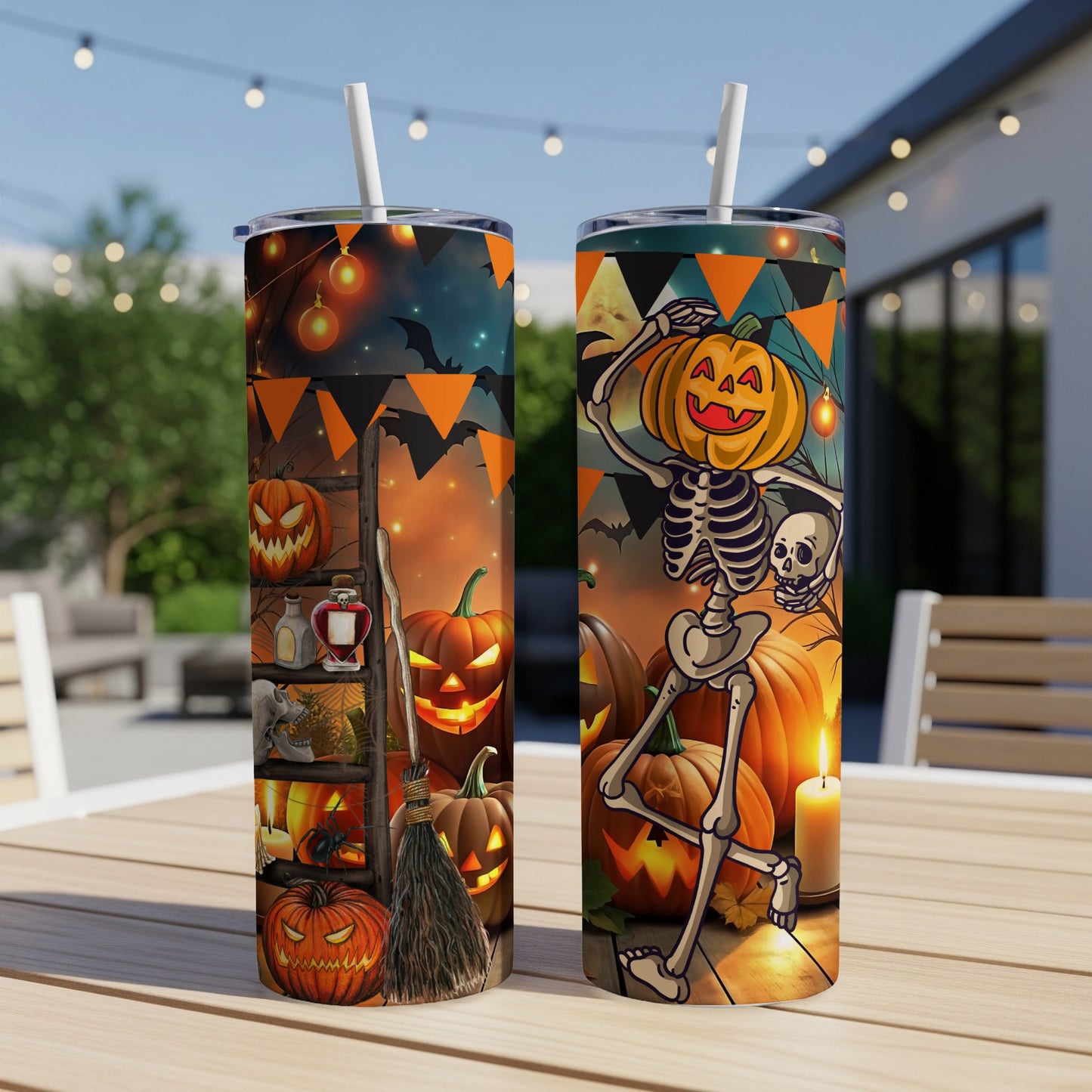 Two tumblers with a Halloween theme featuring skeletons, pumpkins, and bats.