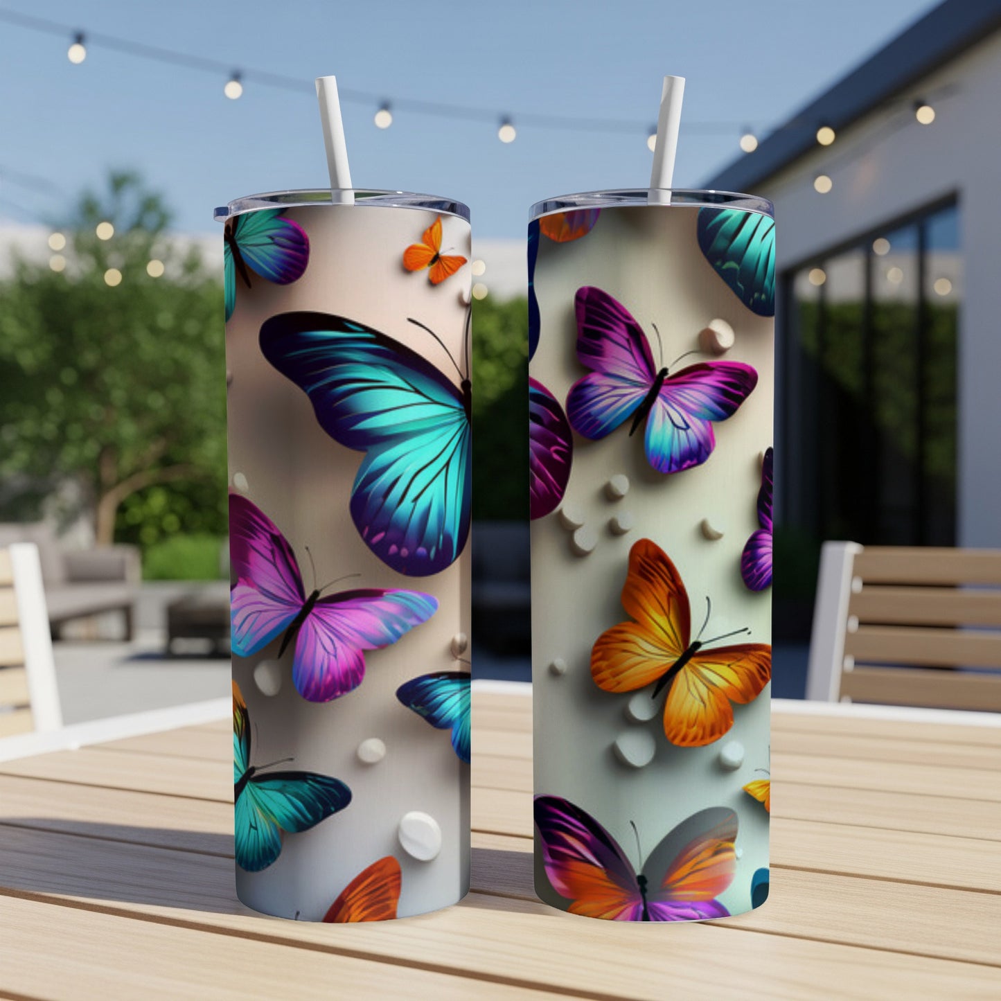 Two tall, slender tumblers with colorful butterfly designs and white dots.