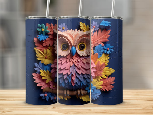 Dark blue tumbler with a colorful owl and floral design.