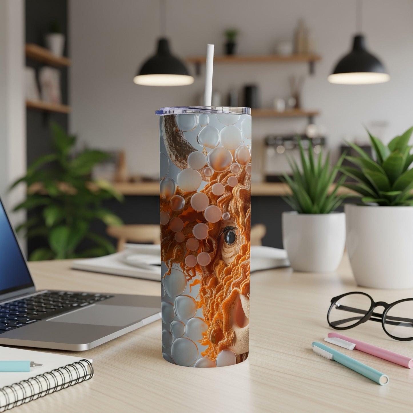 Highland cow face with abstract bubbles pattern on a stainless steel tumbler.