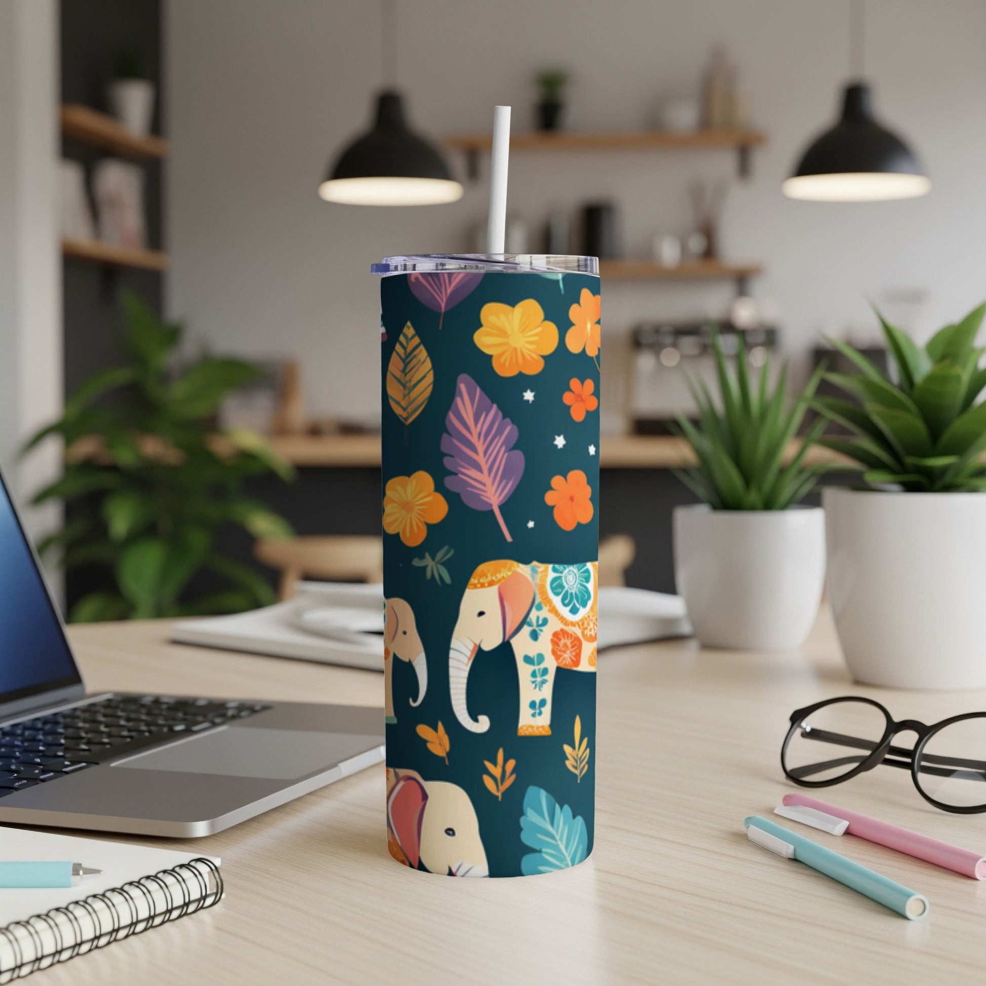 Dark blue tumbler with elephants and floral pattern.