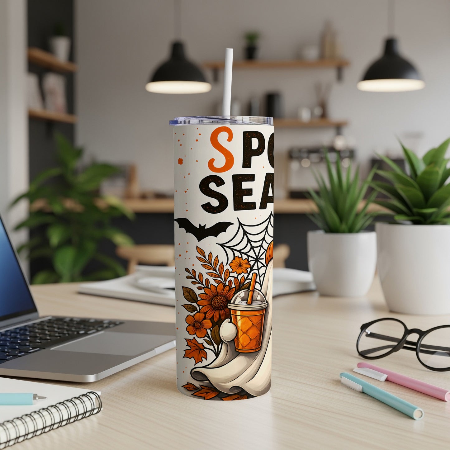 Tumbler with "Spooky Season" text, ghost, and fall leaves design.