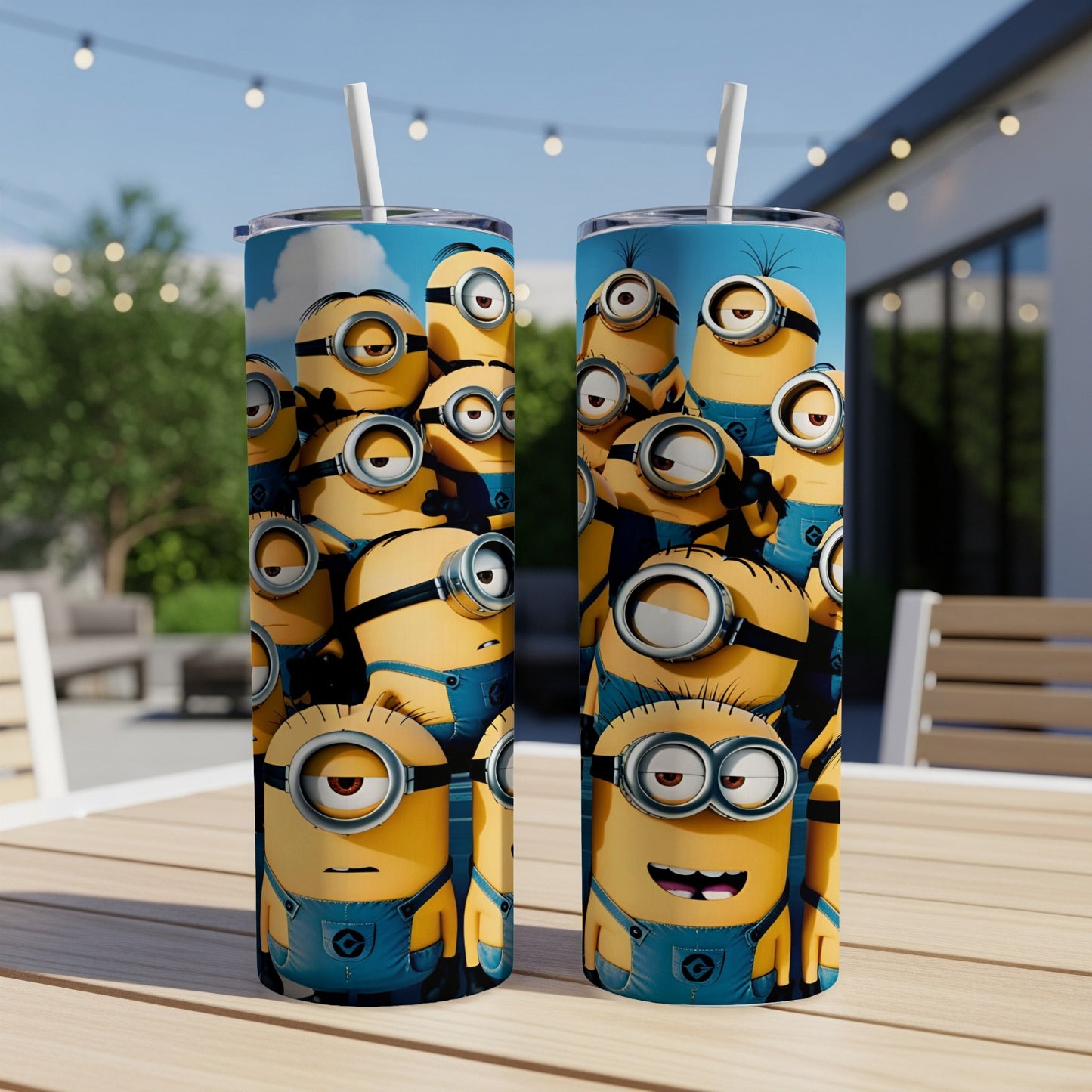 Two Minion tumblers on a wooden table with a blurred outdoor background.
