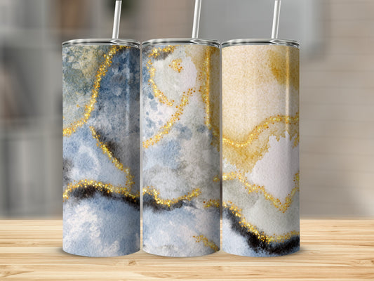 Three tumblers with blue and gold marbled watercolor designs and glitter accents.