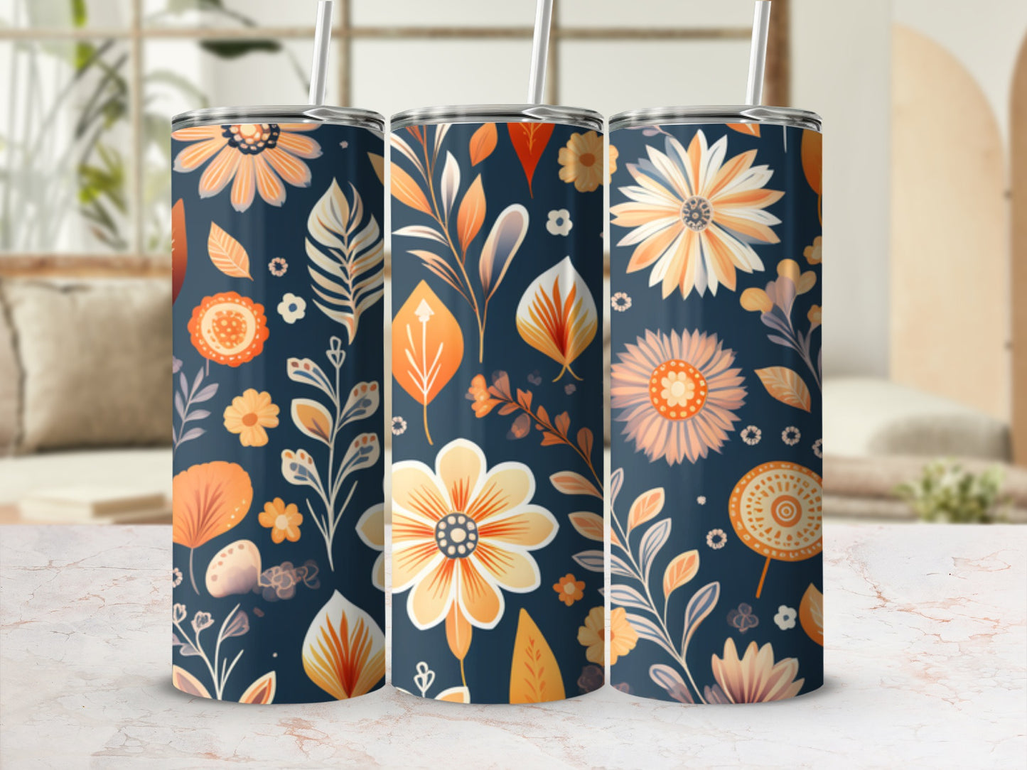 Three tumblers with a floral and leaf pattern in orange and blue hues.
