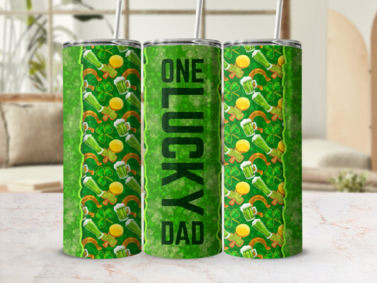 Green tumbler with shamrocks, horseshoes, and "ONE LUCKY DAD" text.