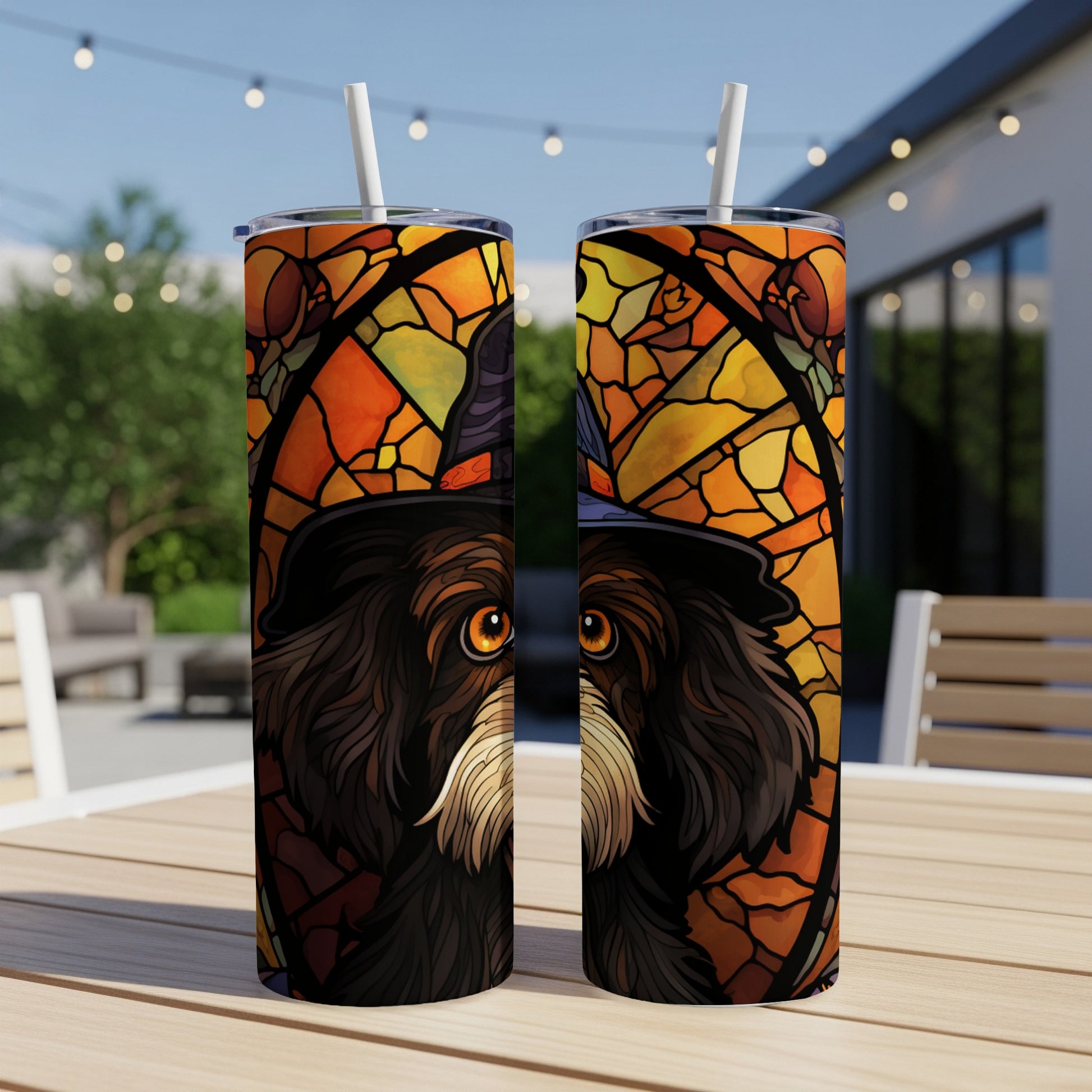 Dog wearing a witch hat, stained glass design, on two tumblers.