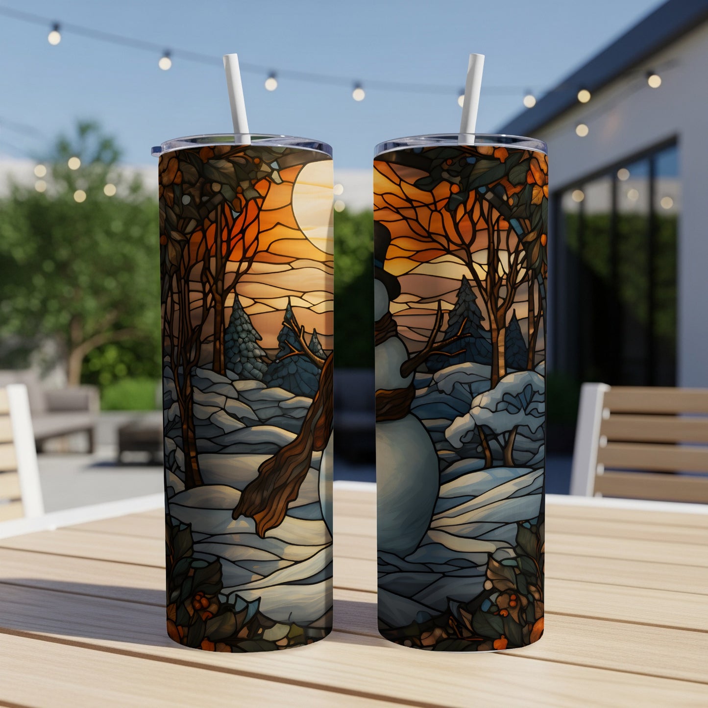 Two stained-glass style tumblers depicting a snowy winter scene with a snowman.
