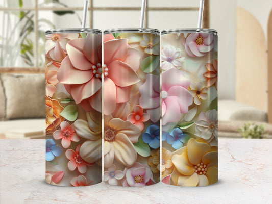 Three floral tumblers with lids and straws, featuring pastel blooms.