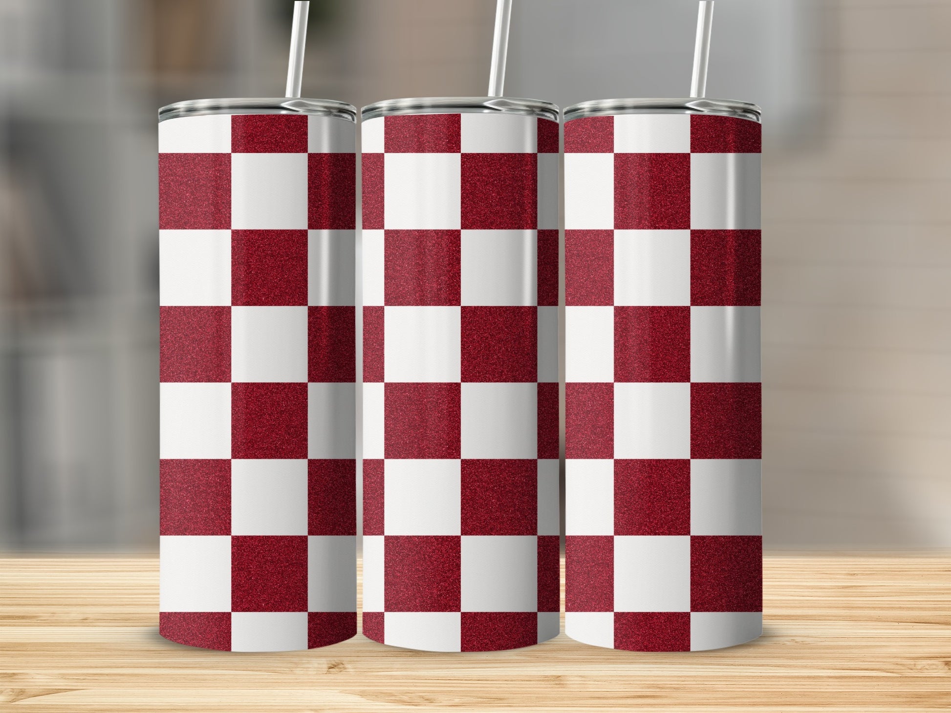 Three tumblers with a red and white checkerboard glitter design.