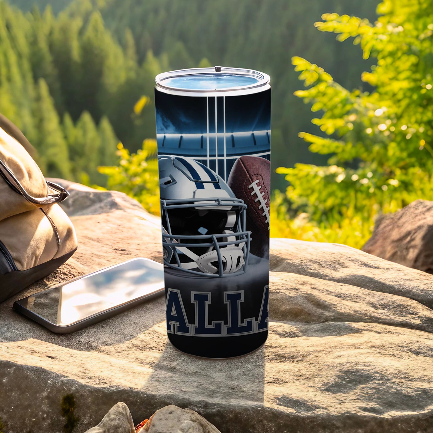 Dallas Cowboys helmet and football on a tumbler outdoors.
