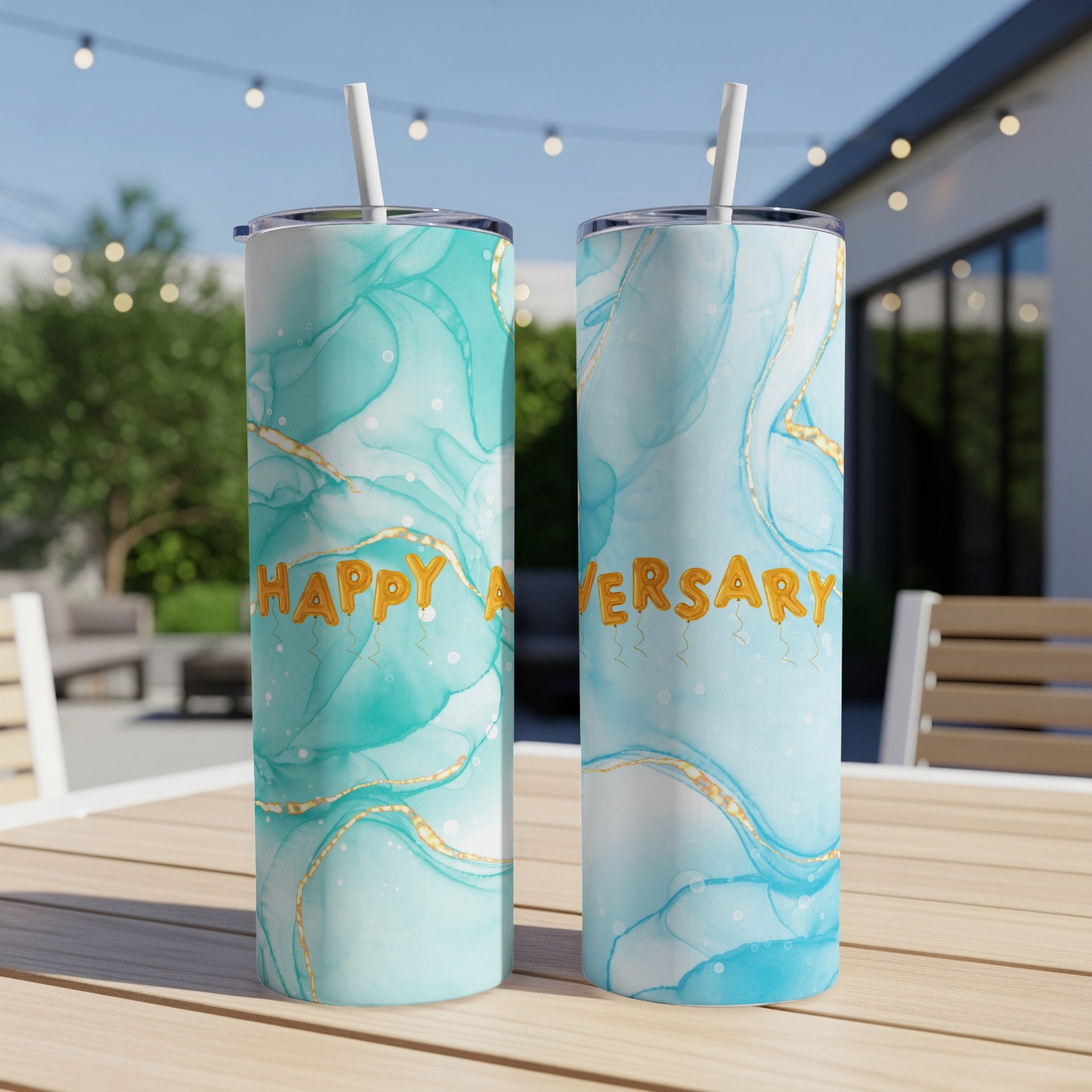 Two tumblers with teal and gold marble patterns, saying "Happy Anniversary".