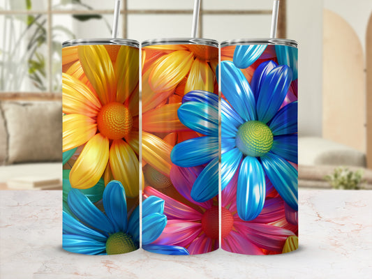 Three tumblers with vibrant floral designs of blue and yellow flowers.