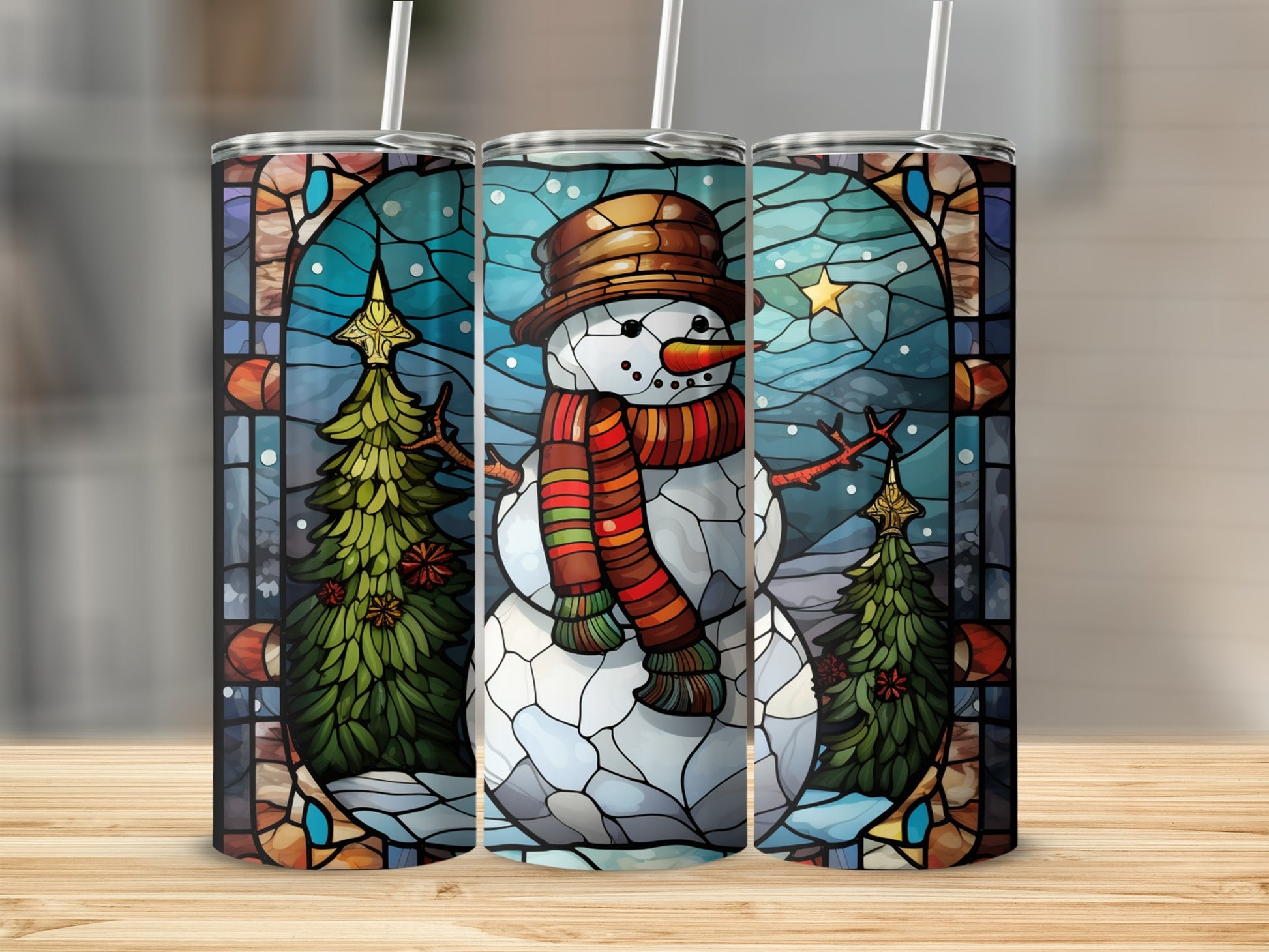 Stained glass snowman and Christmas tree design on three tumblers.